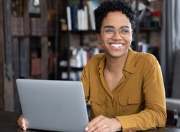 Employee talking in front of laptop